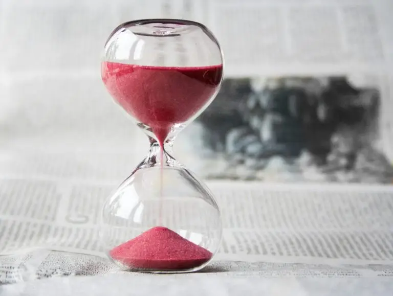 Home Hourglass with red sand