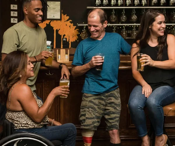 Social Skills Bar woman in wheelchair chatting at a bar with friends